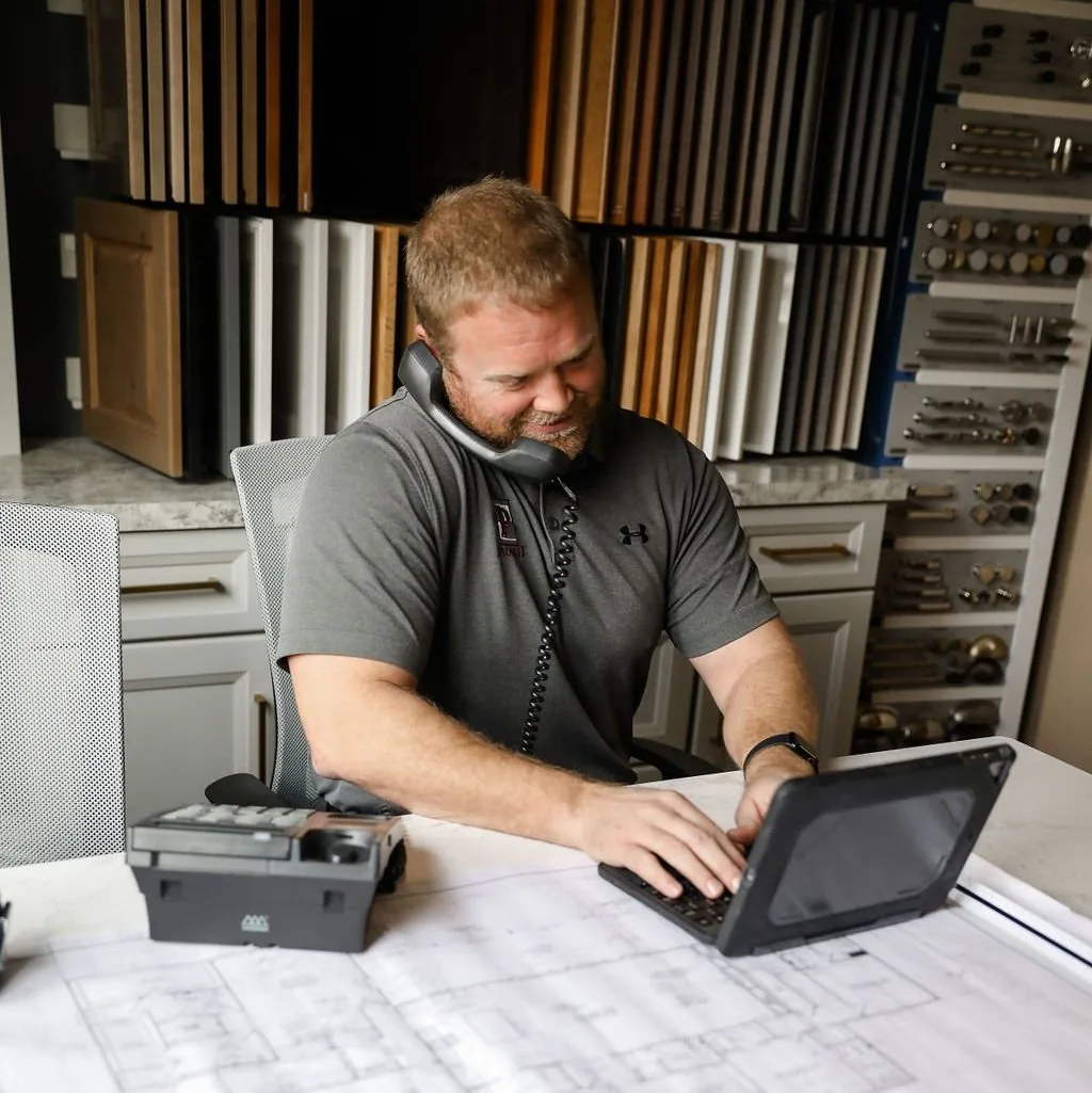 A Padgett team member reviewing plans on a job site